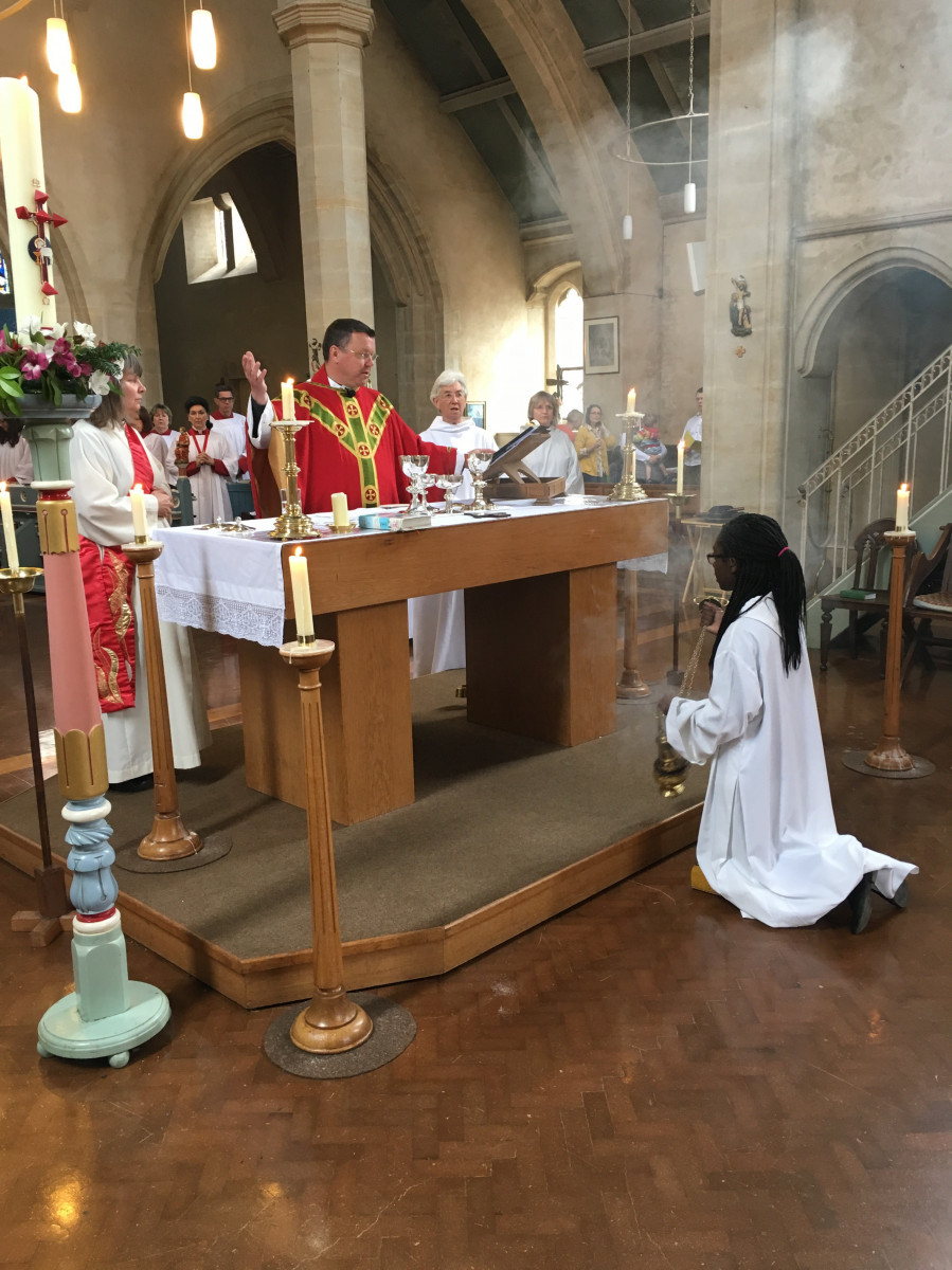 Priest prays the prayer of consecration at the altar